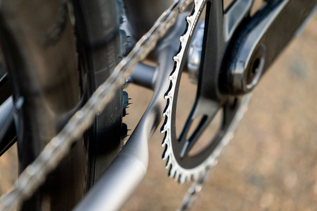 1x chainring and titanium frame detail on the Moots Routt gravel bike